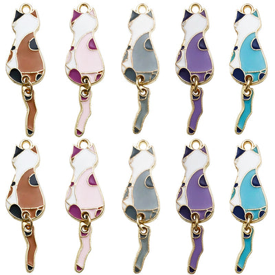 Colorful cat charms arranged on a light background