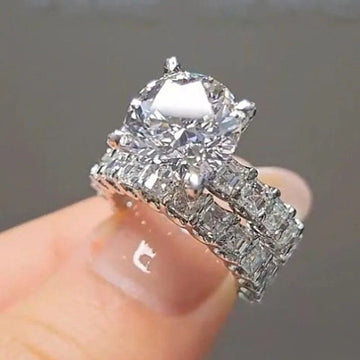 Round Solitaire And Baguette Two-Ring Set In Silver Tone