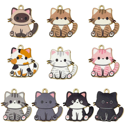 Colorful cat charms arranged on a light background