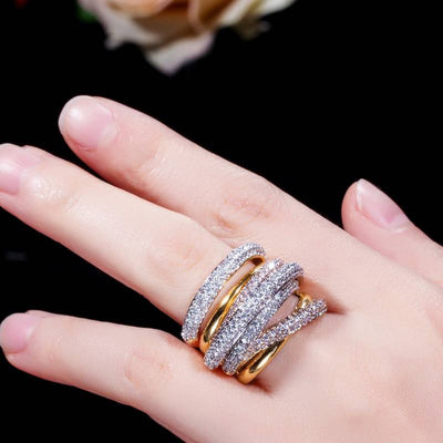 Two-tone multi-band pave CZ ring worn on finger