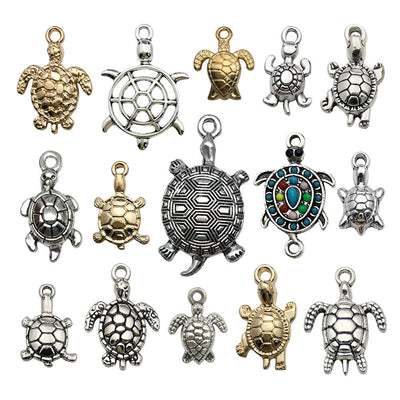 Metallic turtle charms arranged on a light background