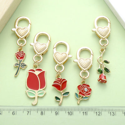 Image 1 showing rose, sunflower and flower keychains shown in the product image.