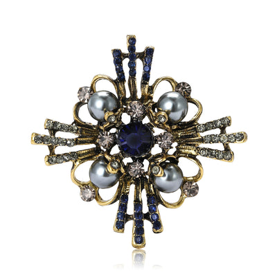 Antique Gold Geometric Pearl Brooch shown alone on a light background