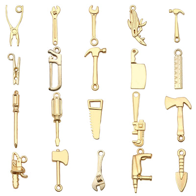 Gold-tone assorted shape charms arranged on a light background