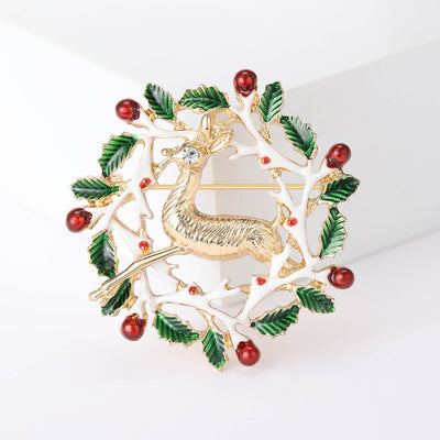 Front view of reindeer head framed by a leafy wreath