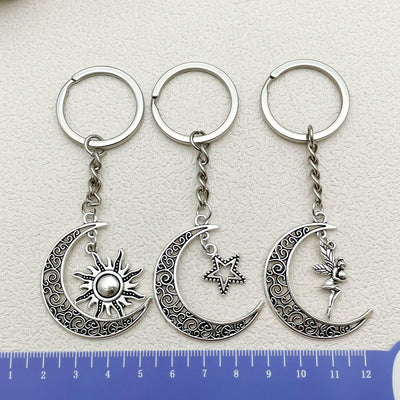 Image 1 showing 3pcs / lot new fashion keychaig moon and sun charms pendants for women men jewelry accessories.