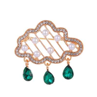 Front product view of an emerald green brooch