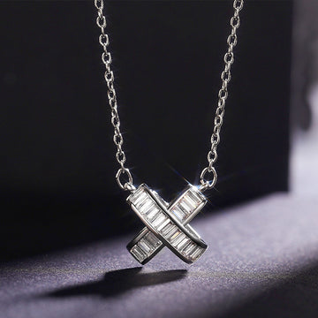 Silver Tone Crossed Bar Pendant Necklace With Clear Stones