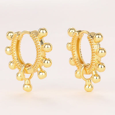 Gold beaded ball accent huggie hoop earrings pair front view