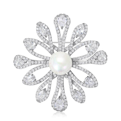 Silver pearl center flower brooch with pave zircon petals on white