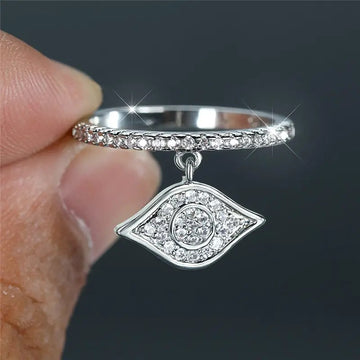 Silver Tone Crystal Eye Dangle Ring With Clear Stone Band