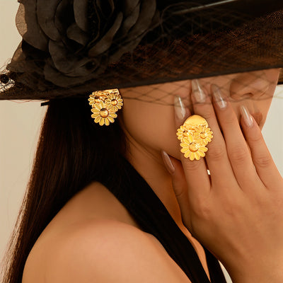 On-ear view of layered daisy cluster earrings in main image 1.