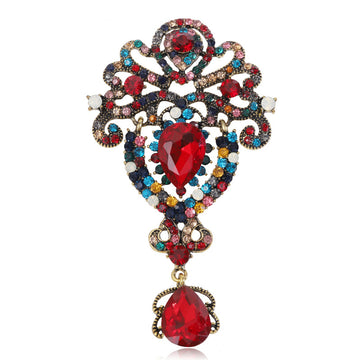 Ornate Crystal Dangle Brooch An Ornate Scrollwork Brooch
