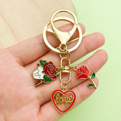 Image 1 showing a person holding two different colored rings.