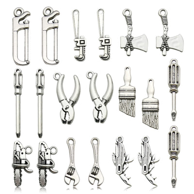 Antique silver assorted shape charms arranged on a light background