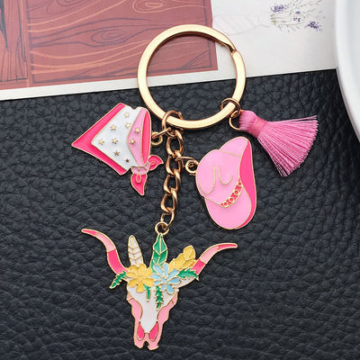 Overview showing the available color and design variations of the pink western hat floral longhorn metal keychain