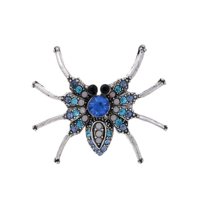 Front product view of the spider brooch pin in silver and blue
