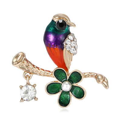 Enamel multicolor bird on branch with green flower and crystal dangle
