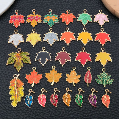 Colorful leaf charms arranged on a light background