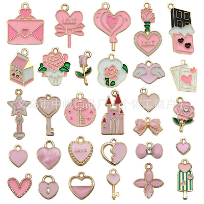 Pink heart charms arranged on a light background