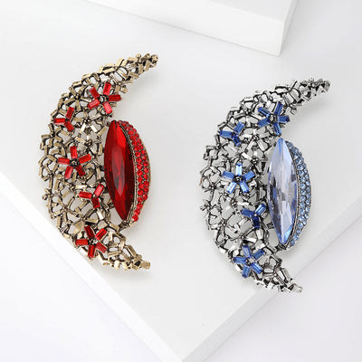 Crescent Moon brooch shown in the available finishes