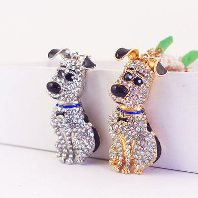 Gold-tone and silver-tone rhinestone dog charms displayed side by side.
