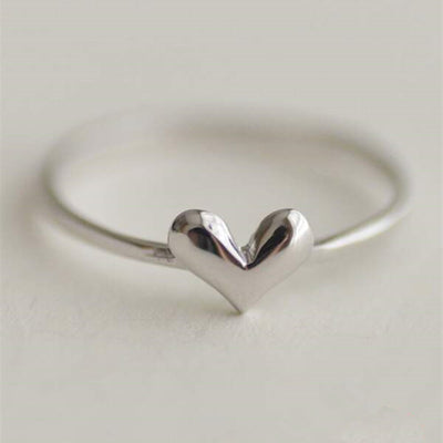White metal polished solid heart thin band ring close-up
