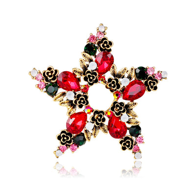 Front product view of the five point star brooch pin in gold and red