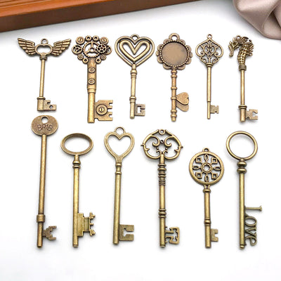Gold-tone assorted shape charms arranged on a light background