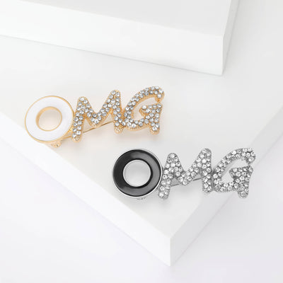 OMG letter design brooch shown from the front