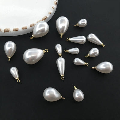 Black bell charms arranged on a light background