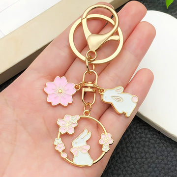 Twelve Pink Rabbit Blossom Wreath Metal Keychain Designs