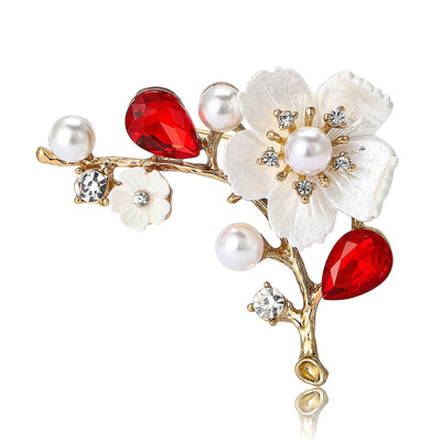 Front view of branch of enamel blossoms with pearls and colored teardrop crystals