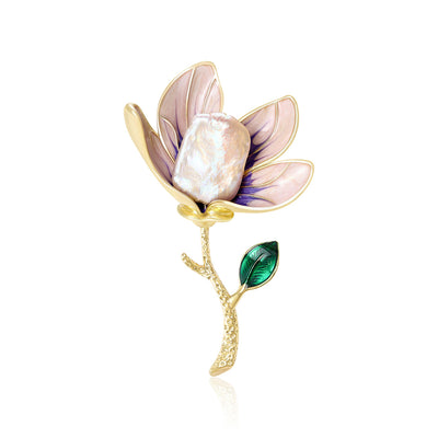 Front view of purple translucent magnolia brooch with pearl-like center against a white background.