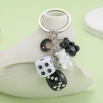 Dice Charm Keychains Featuring Black Moon Across 10 Pictured Variations