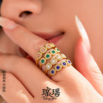 Hand stacked with gold multi-color three-halo open band rings