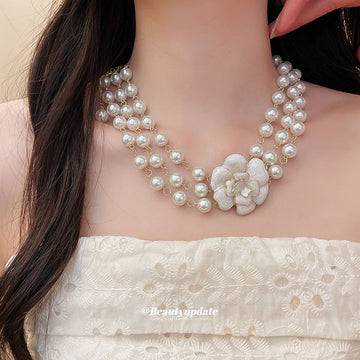 Layered Faux Pearl Necklace with White Floral Centerpiece