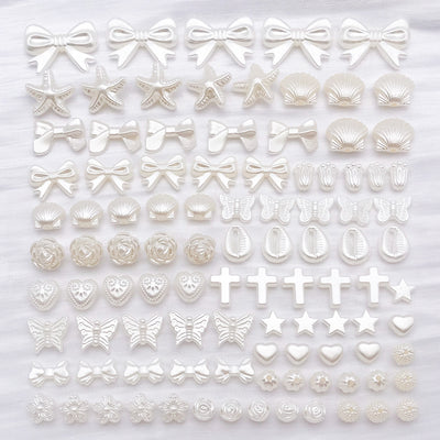 Front product photo of ivory faux pearl shaped spacer bead showing the pictured design arrangement