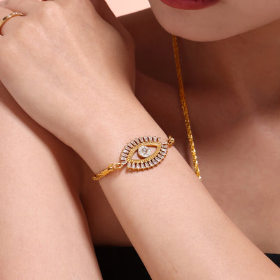 Gold evil eye zircon bracelet on model wrist close-up