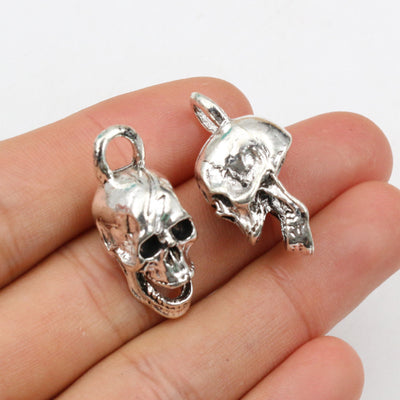 Dimensional skull charms showing assorted shapes and finishes