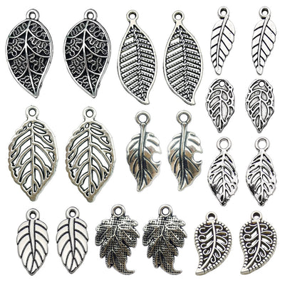 Antique silver leaf charms pictured with visible surface details
