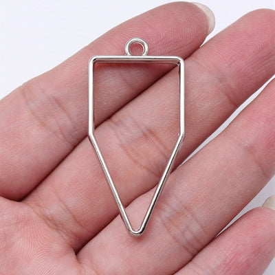 Open Tapered Shield Resin Frame Charms hand-held front view