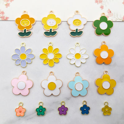 Colorful flower and sun charms arranged on a light background