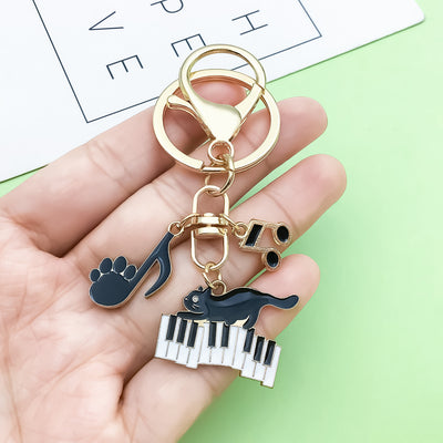 Image 1 showing a person holding two keys in their hand.