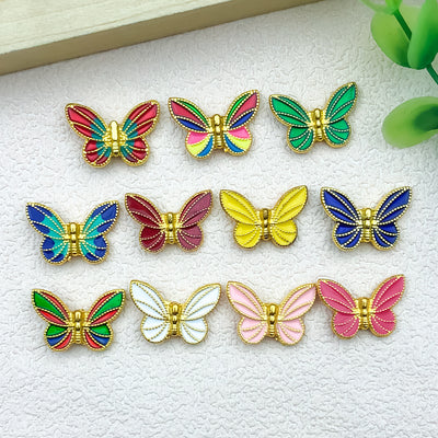 Colorful butterfly charms arranged on a light background