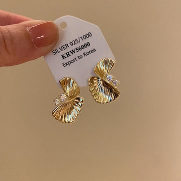 Gold Tone Textured Twisted Fan Stud Earrings with Crystal Centers