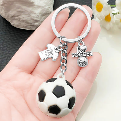 Front display of four molded ball sport keychains with visible colors and attached hardware
