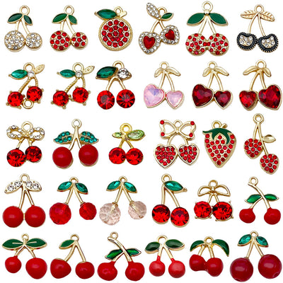 Colorful cherry and strawberry charms pictured with visible surface details