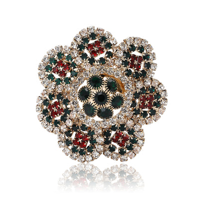 Front view showing the round crystal flower brooch with antique gold petal setting