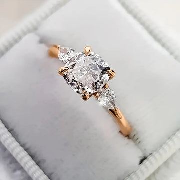 Round Three-Stone Ring In Gold, Silver, And Rose Tones